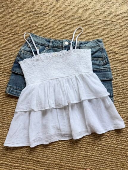 White ruffle sleeveless top